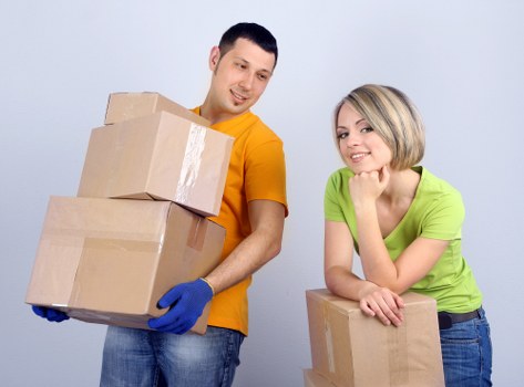Removal team handling furniture during a local move in Uppernorwood