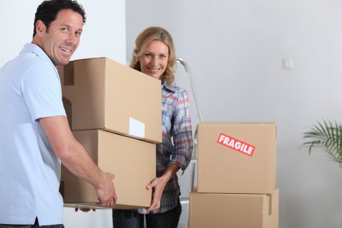 Fragile household items being securely wrapped for transport