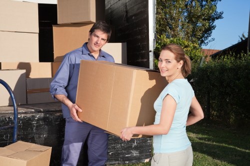 Furniture and boxes being loaded into a van for an Uppernorwood move
